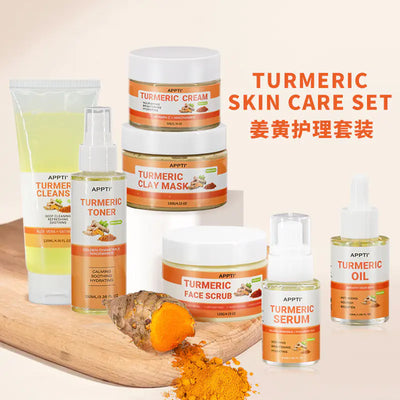 Turmeric Skincare Set displayed on wooden surface with turmeric root and powder.