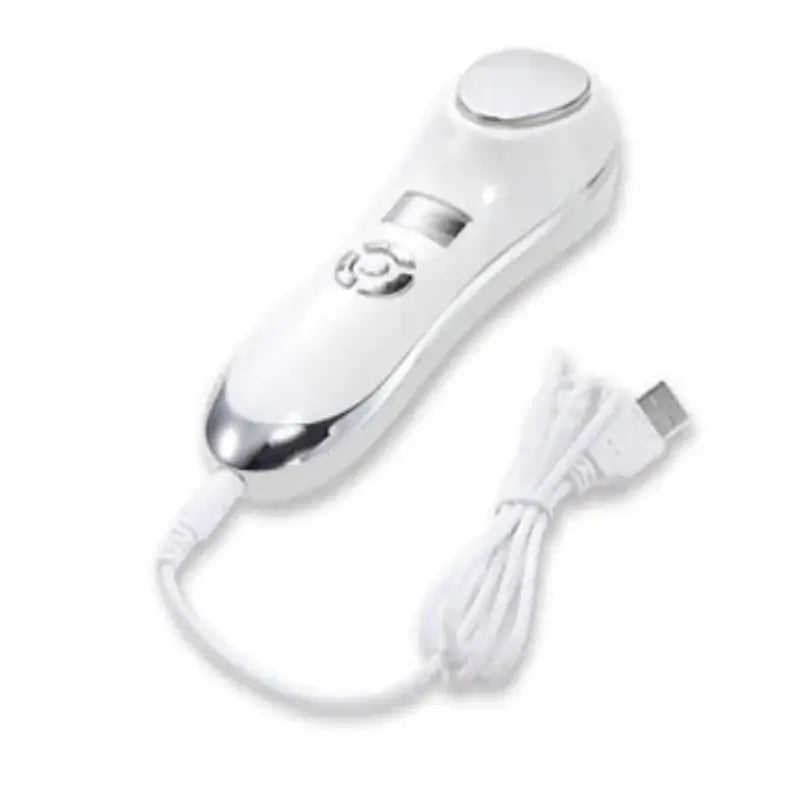 Hot and Cold Vibration Beauty Device for Skincare with USB charging cable.